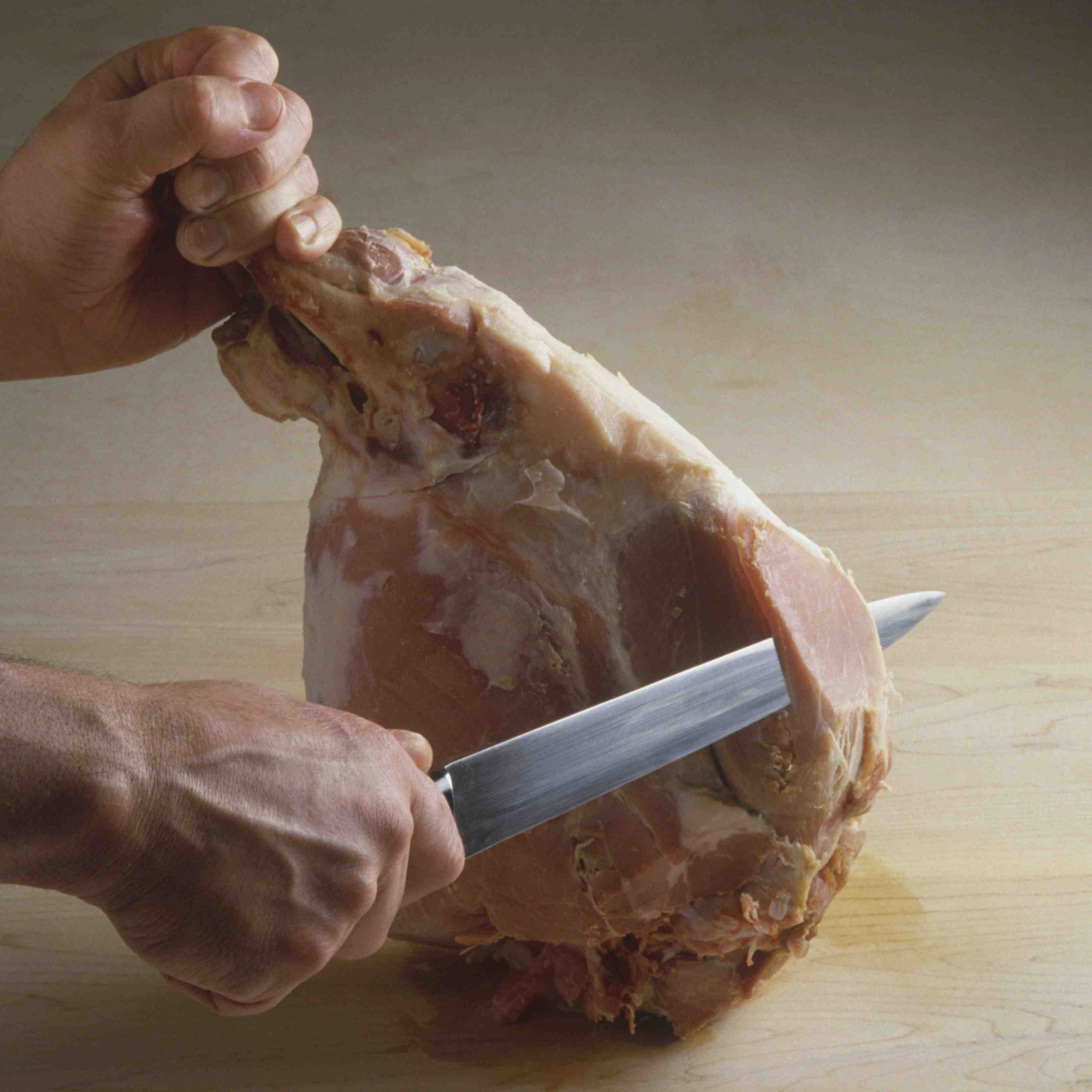 Do you cover a precooked ham when baking?