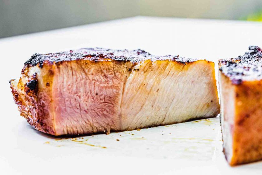 Does pork stay pink when cooked?