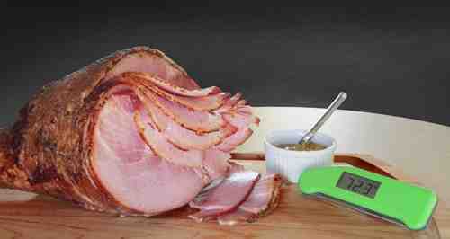 How hot does a precooked ham need to be?
