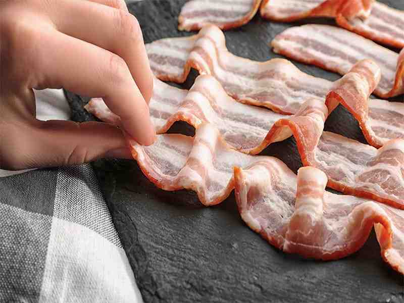How long after eating undercooked bacon Will I get sick?