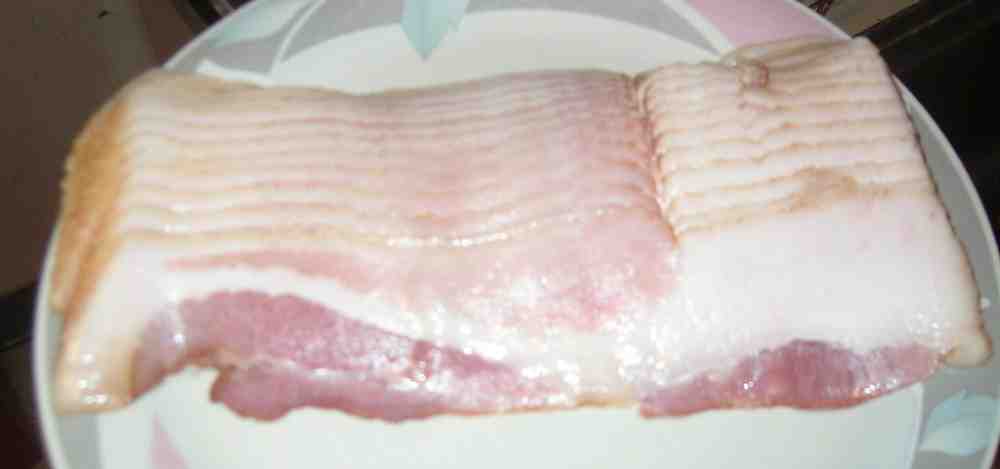 What happens if you eat slightly undercooked bacon?
