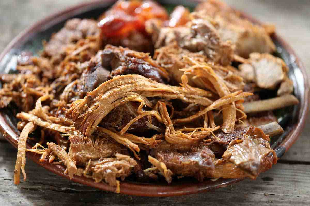 Where do carnitas come from and what meat is it made of?