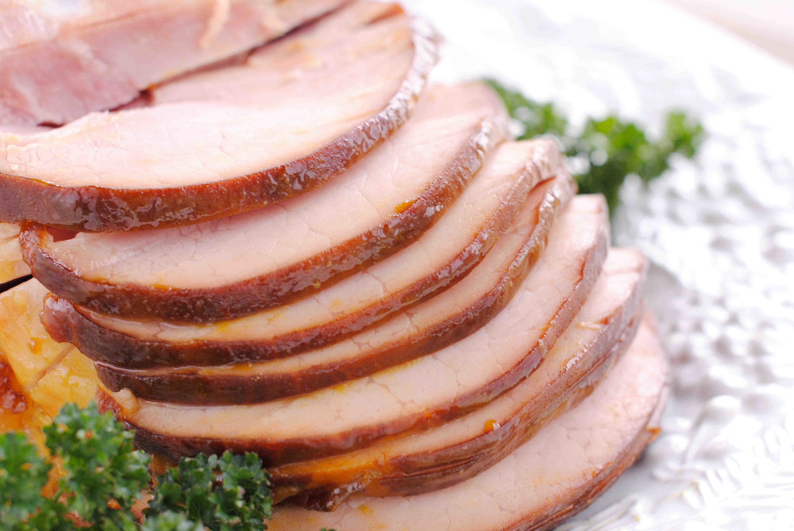 How do you heat up a precooked ham without drying it out?